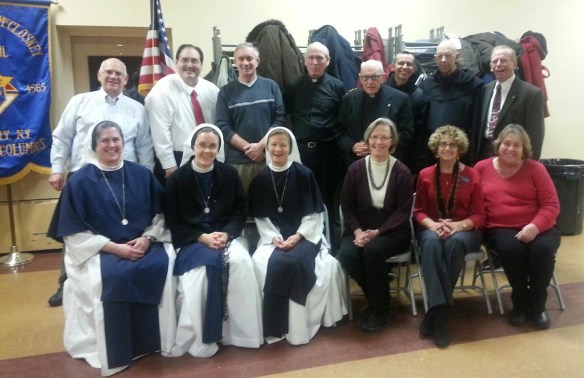 McCloskey Council Grand Knight Arthur Saladino (2nd row, extreme left) and District Deputy Hugh Delargy (2nd row, extreme right) with representatives of some of the organizations who received donations at the Christmas Party.