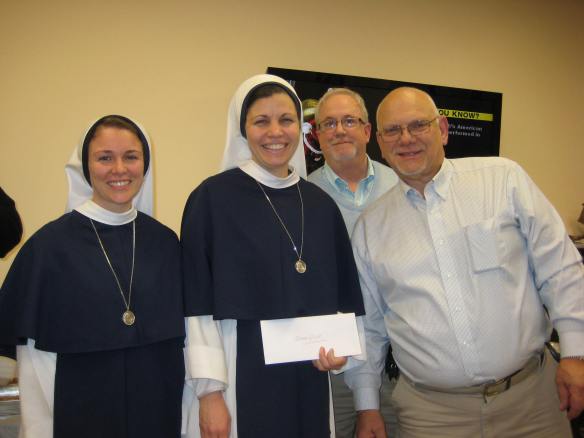 Grand Knight Stephen  Duschaneck and PGK Arthur Saladino present a Christmas donation to the Sisters of LIfe on behalf of the McCloskey Council  Photo courtesy of McCloskey Council 4565.